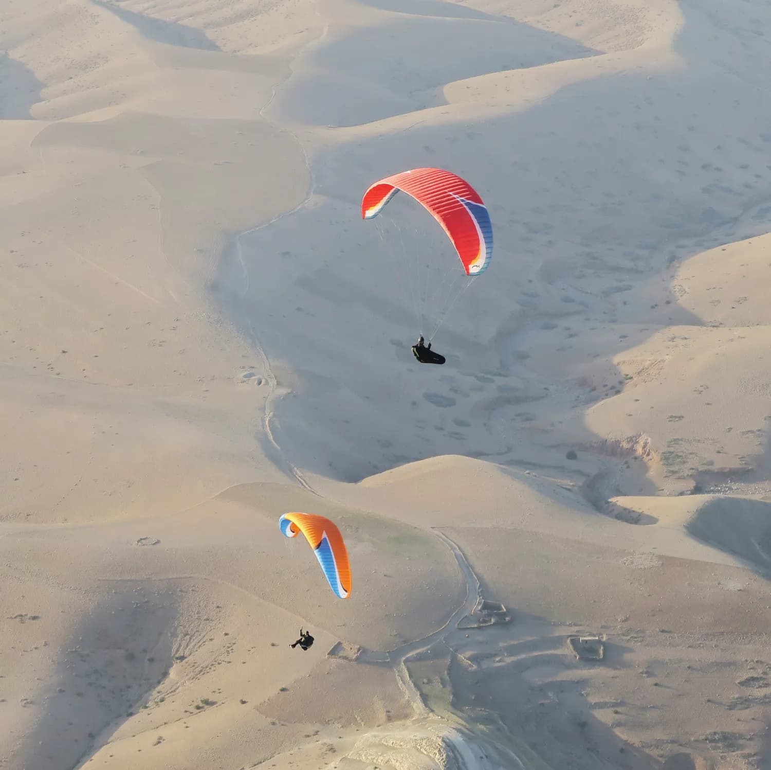 Two Niviuk gliders over Agafay, in Aguergour