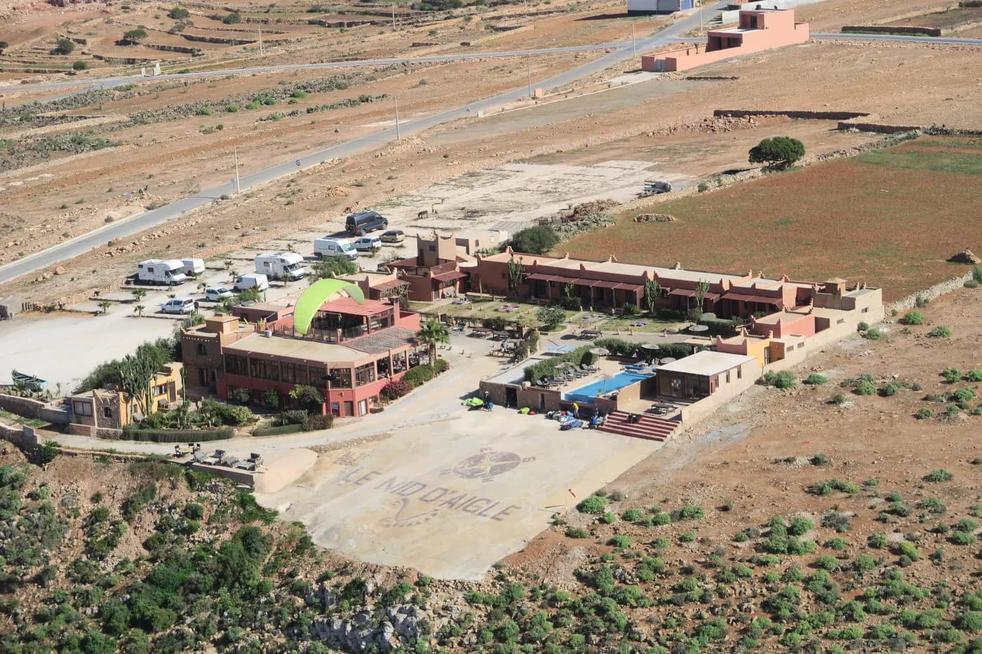 Paraglider flying over Nid d'Aigle, Morocco